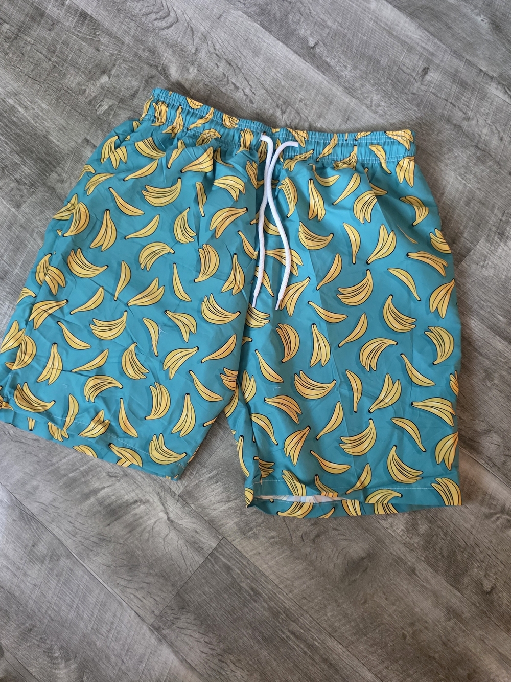 Men's Teal Banana Print Disolving Swim Trunks - Picture 1 of 3